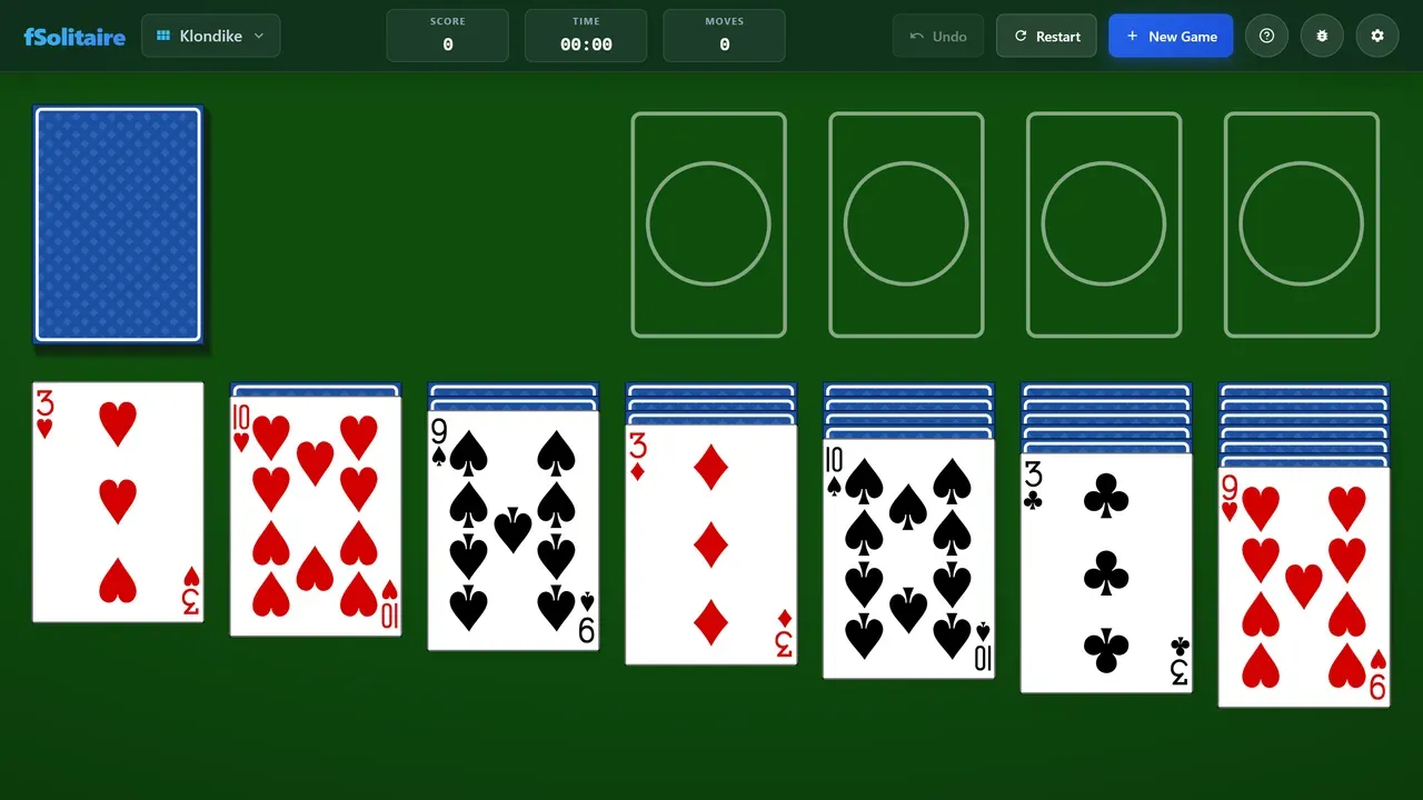 A game of Klondike dealt on green felt.
